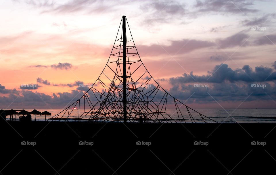 Playground on the beach at sunrise