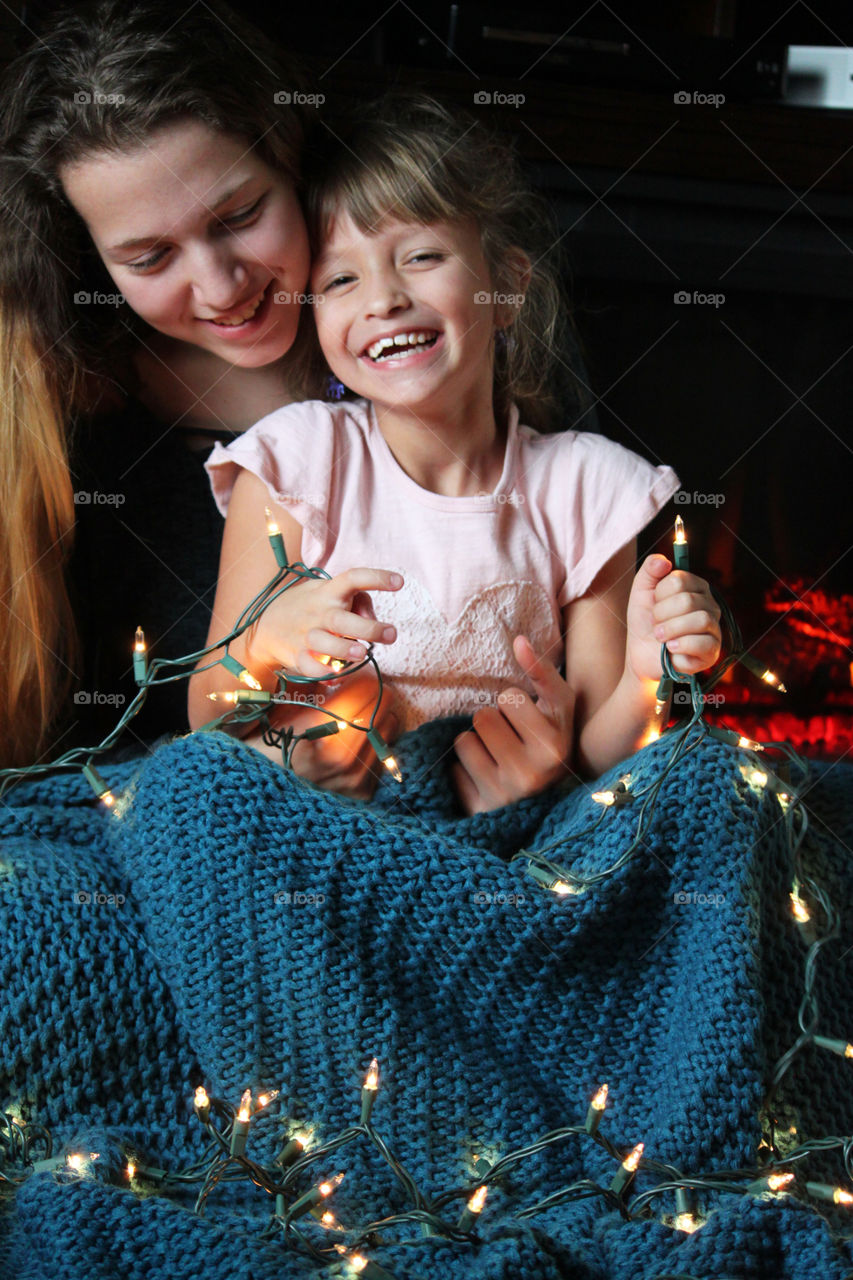 Sisters lovingly embracing