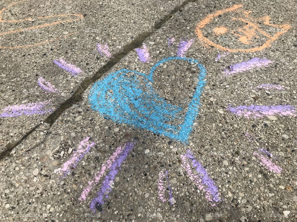 Playing with sidewalk chalk 