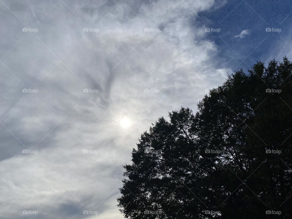 The sun trying to come through the clouds 