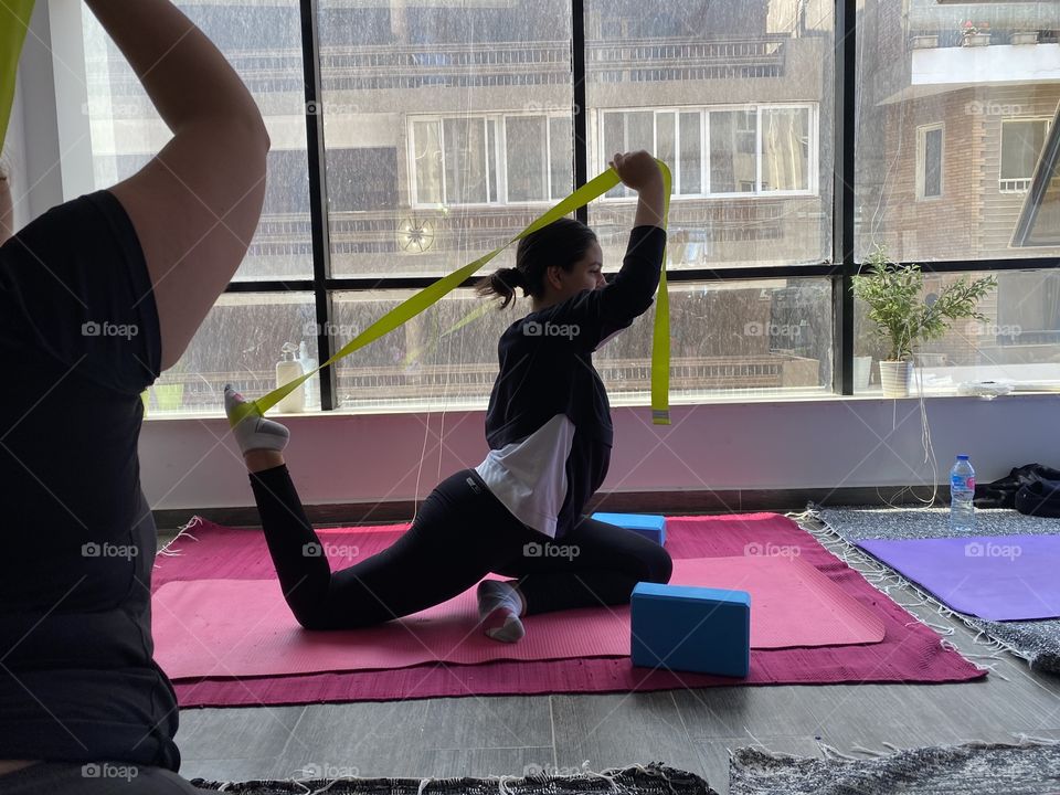 Girl doing a yoga pose flexible 