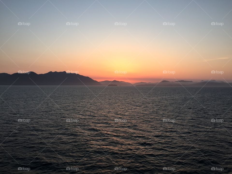 View of sea against sky during sunrise