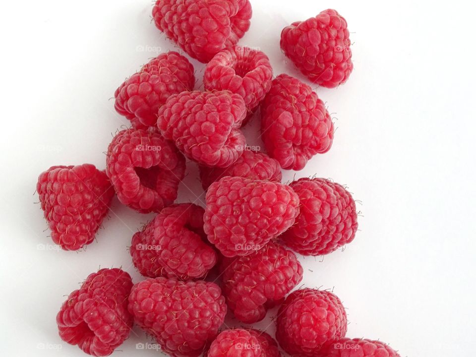 Raspberries on a white background 