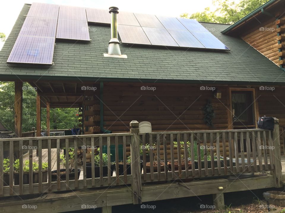 Log cabin solar panels container gardens
