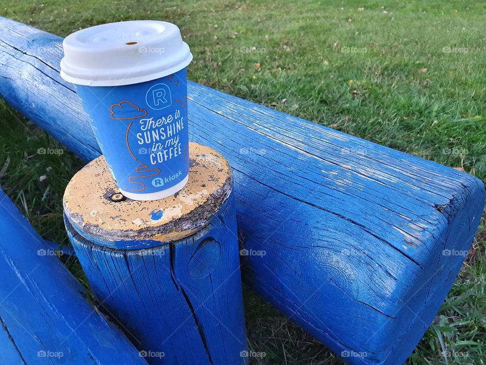 Takeaway coffee on a blue background.