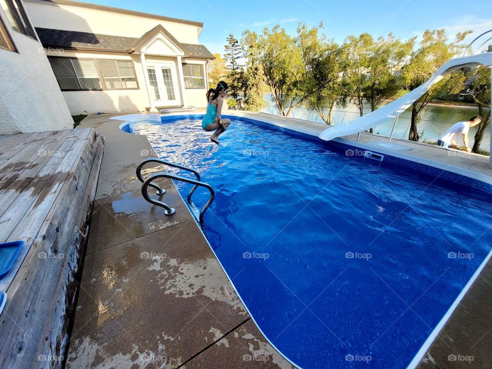 jumping into the pool