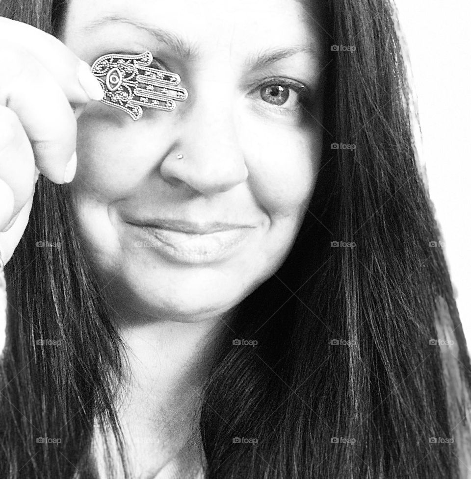 Selfie with evil eye jewelry black and white 