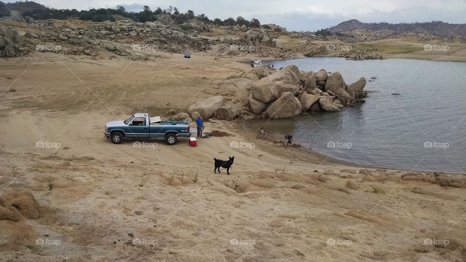 Digging holes, fishing poles, 4X truck our dog Buck. day at the lake
