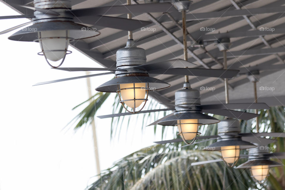 Round fans hanging from the roof 