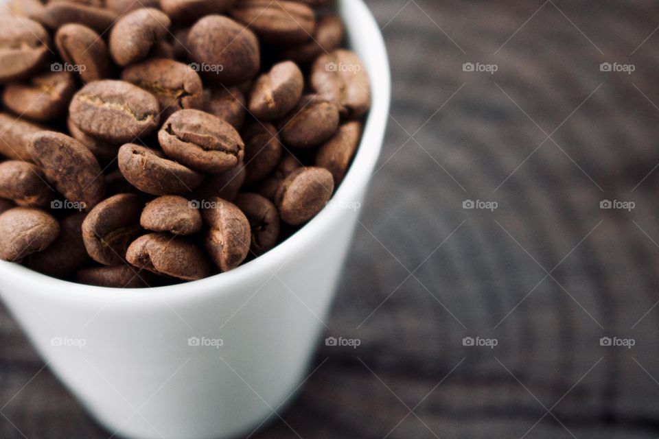 Coffee beans in a mug