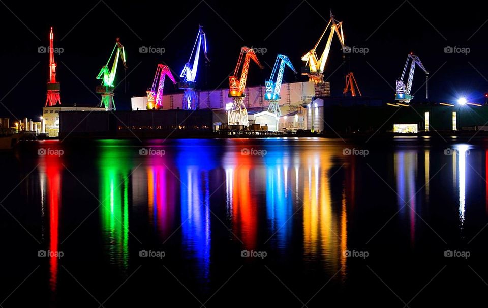 In the day they are just cranes but at night they are striking with their beautiful changing colours reflected in the surrounding seas of Pula in Croatia.
