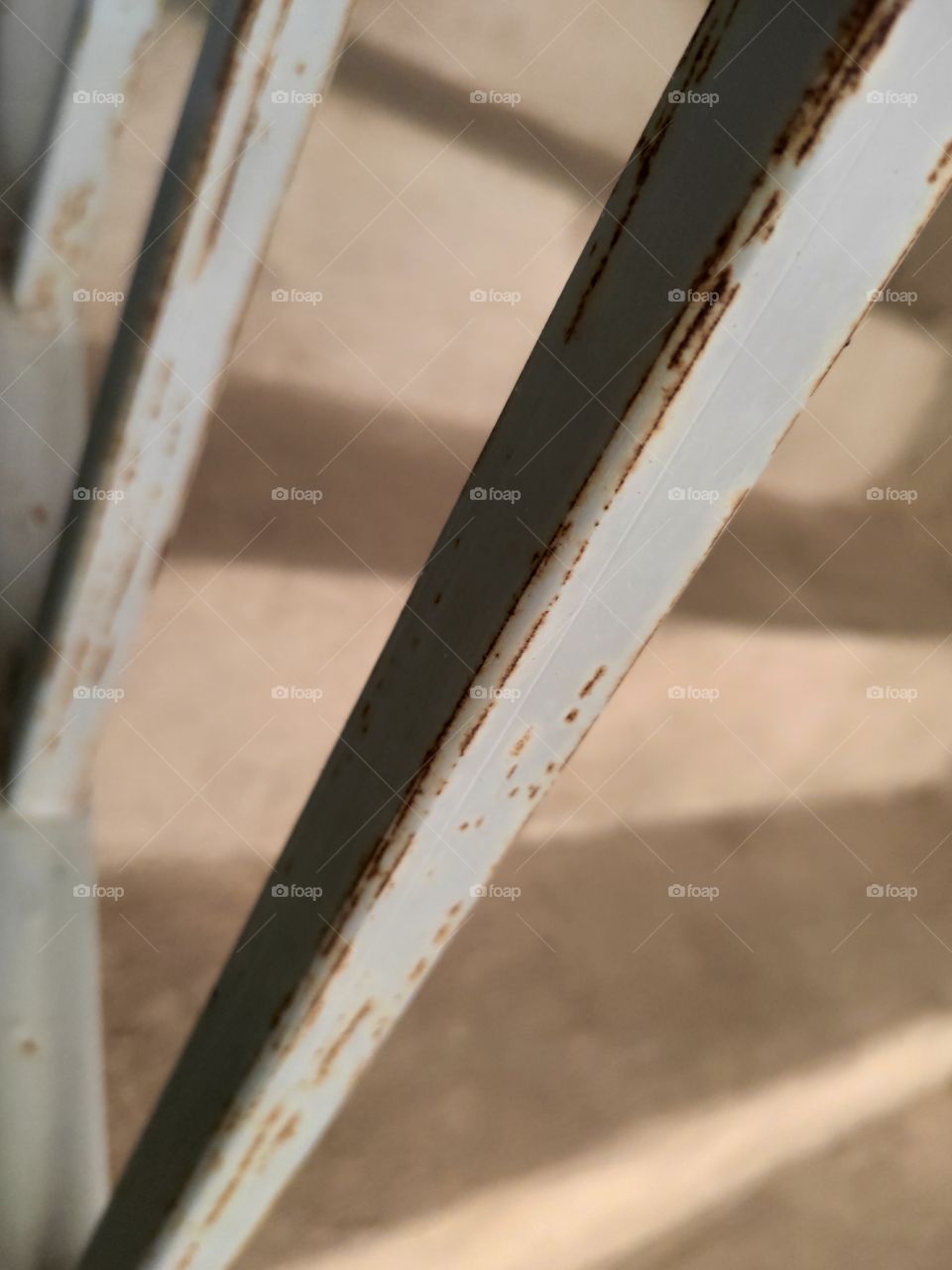 Focus on the fences of a rusted concrete staircase