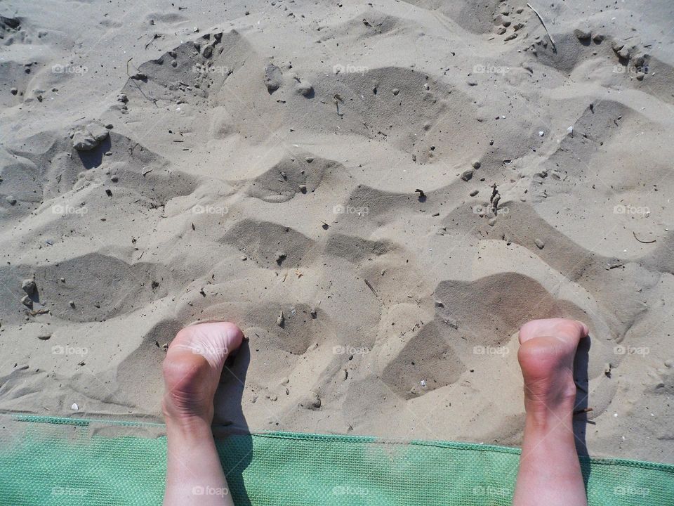 female feet on the sand