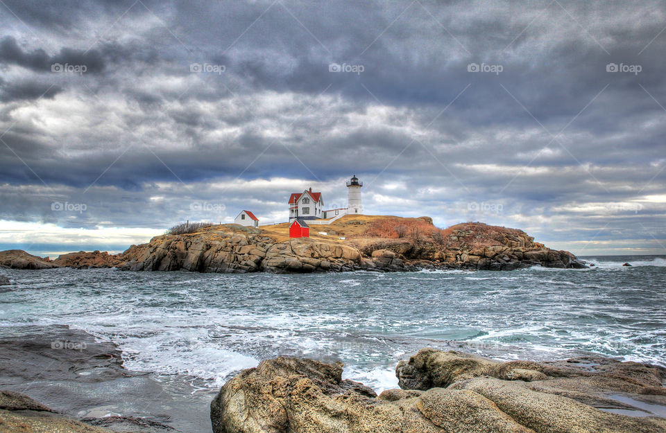 Lighthouse on rocky coastline
