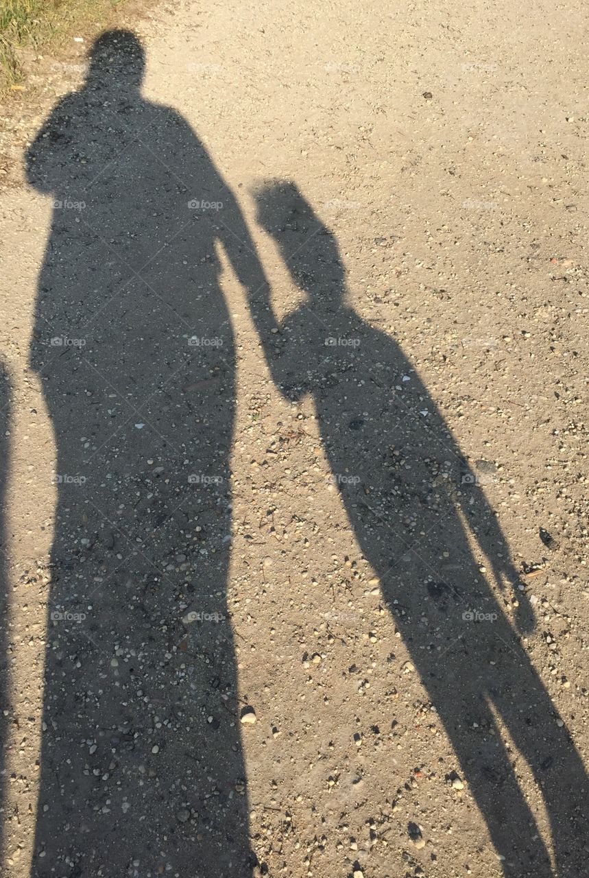 Shadow. Auntie and niece take a walk.