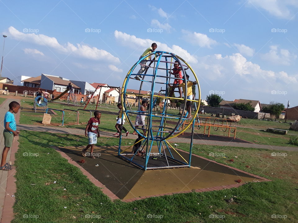 Young people play at the park.