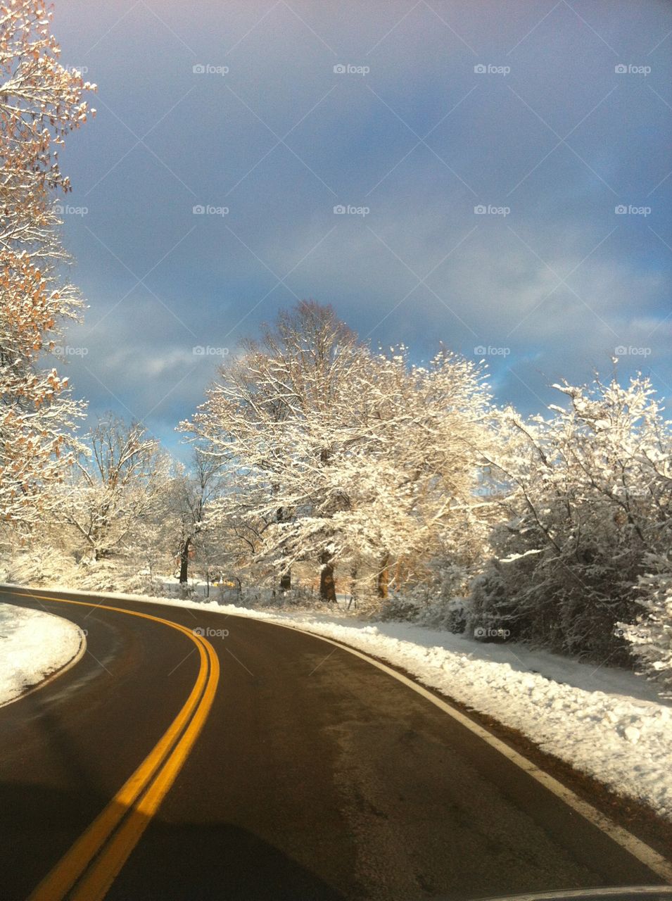 Winter drive, blue skies and snow
