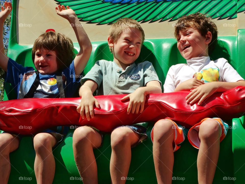 Young Boys On A Carnival Ride