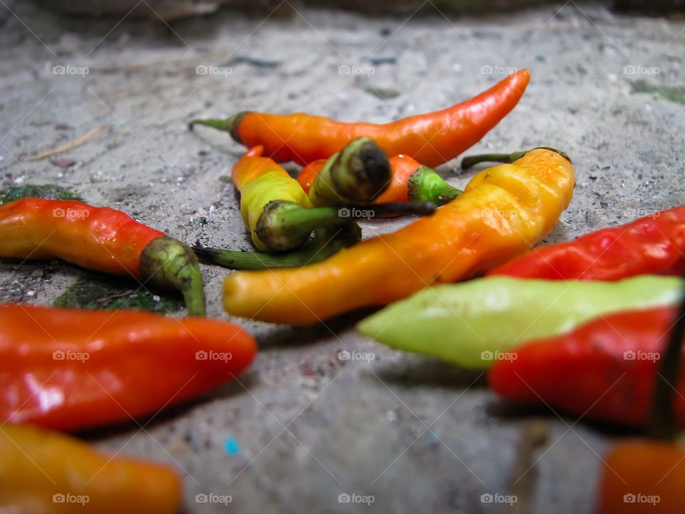 Close-up of cayenne pepper in the sand