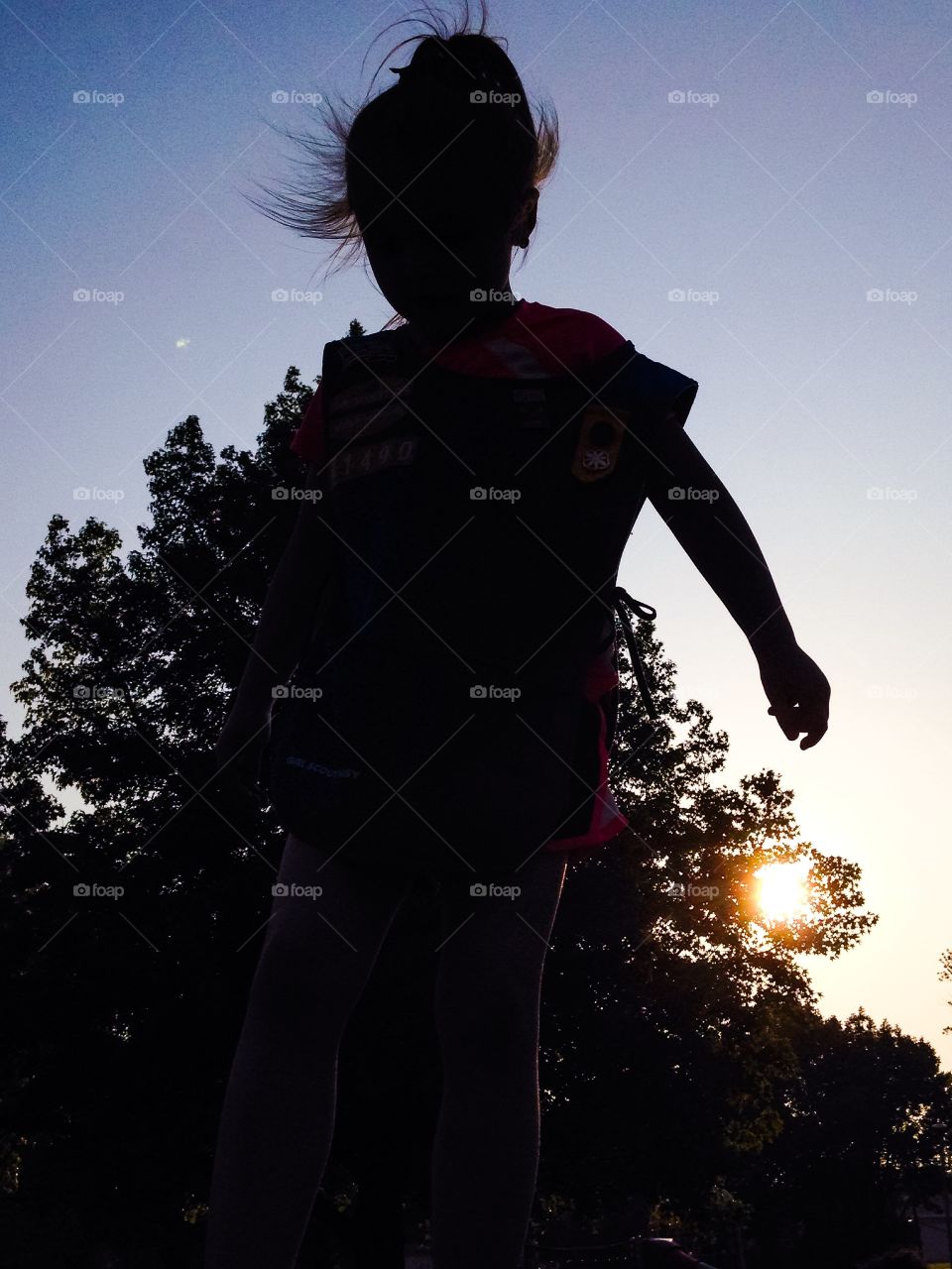 The silhouette of my daughter in the sun.