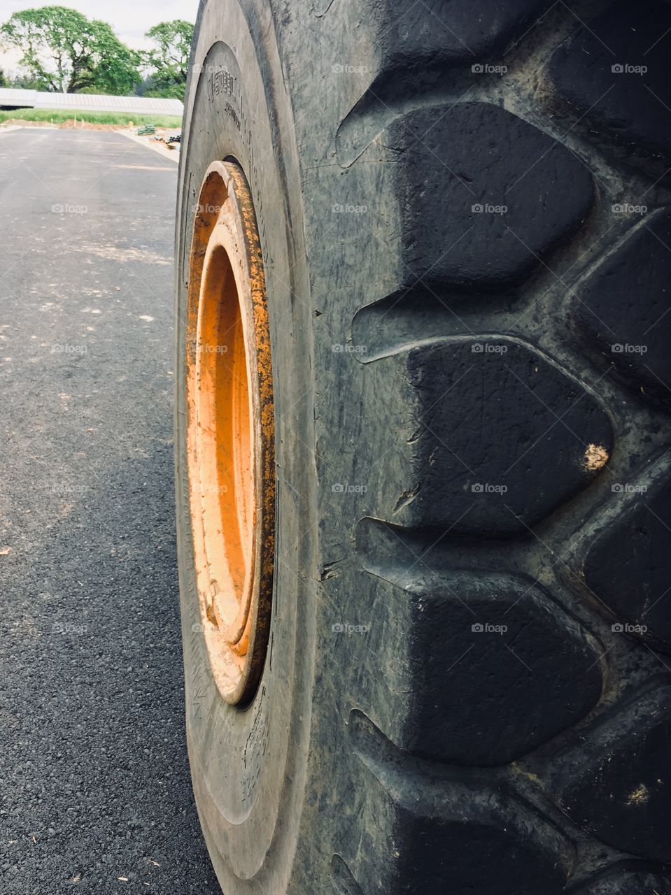 Big bulldozer wheel in a new housing development