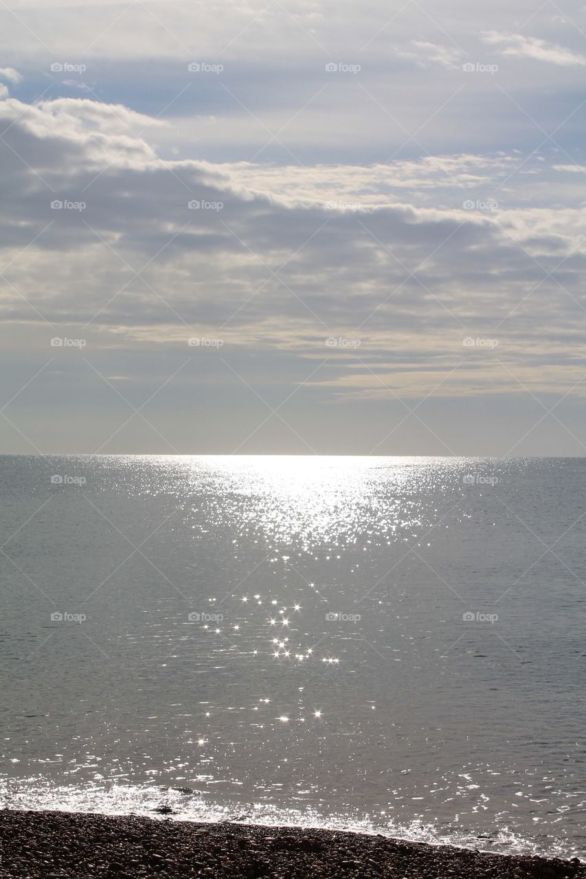 Tiny suns reflected in the sea