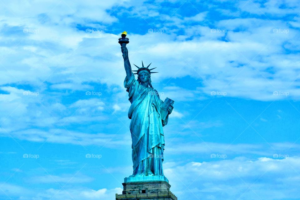 Beautiful lady Liberty on a summer day in New York 