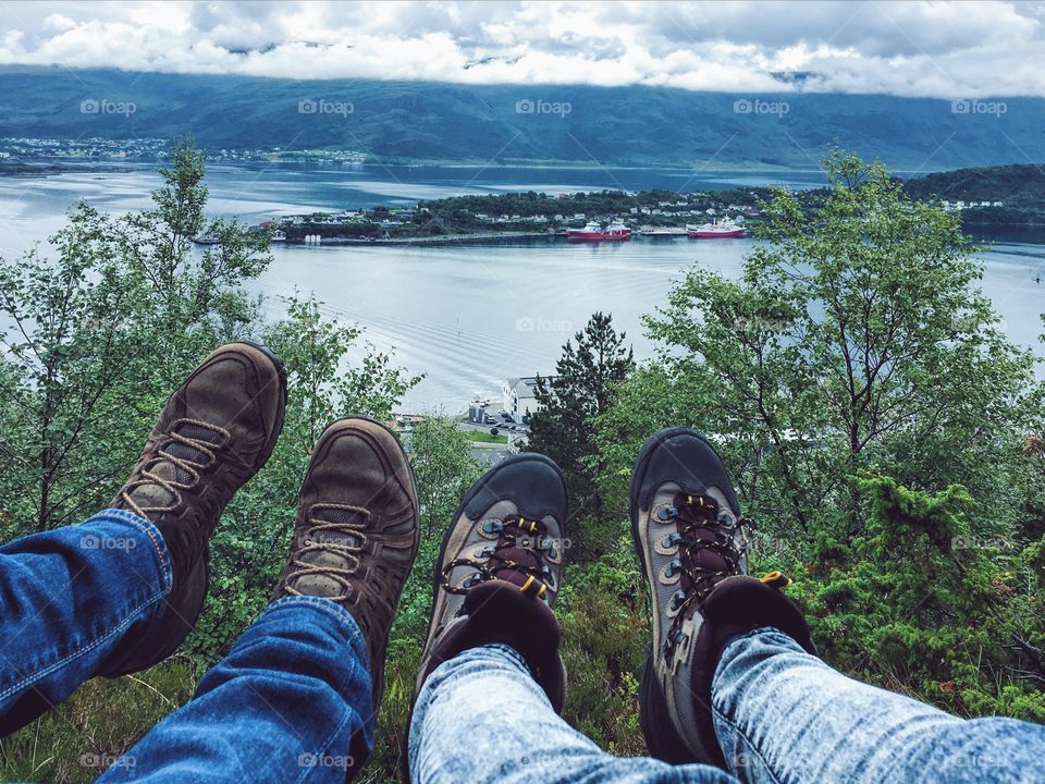 Hiking boots above the city 