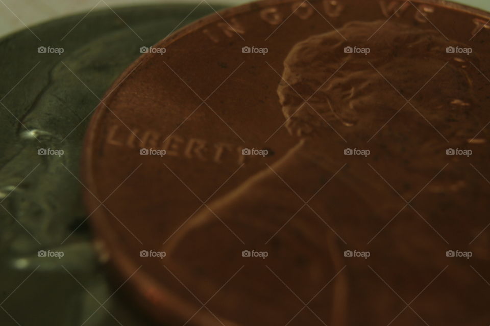 macro photography of nickel and penny