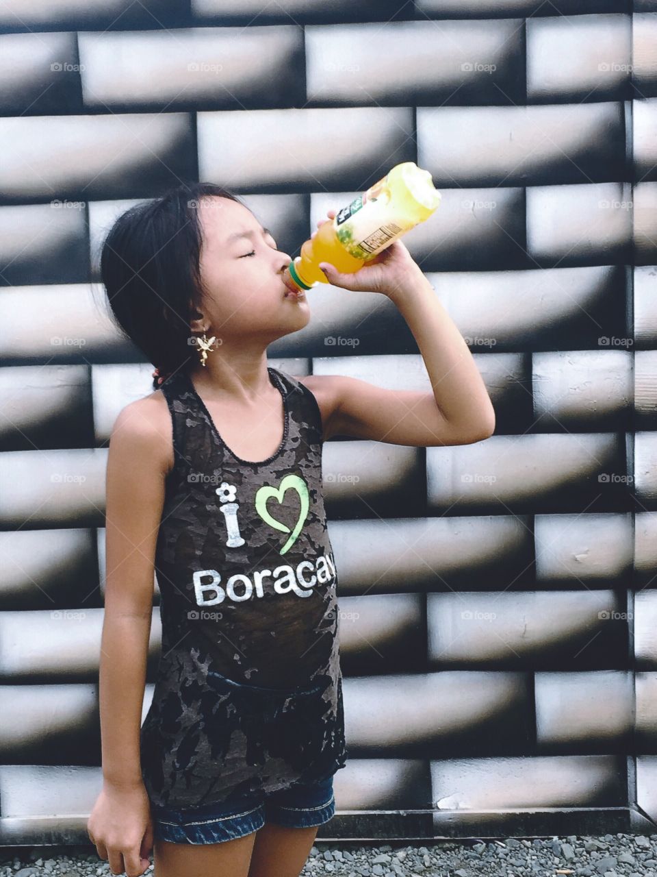 A little girl drinking
