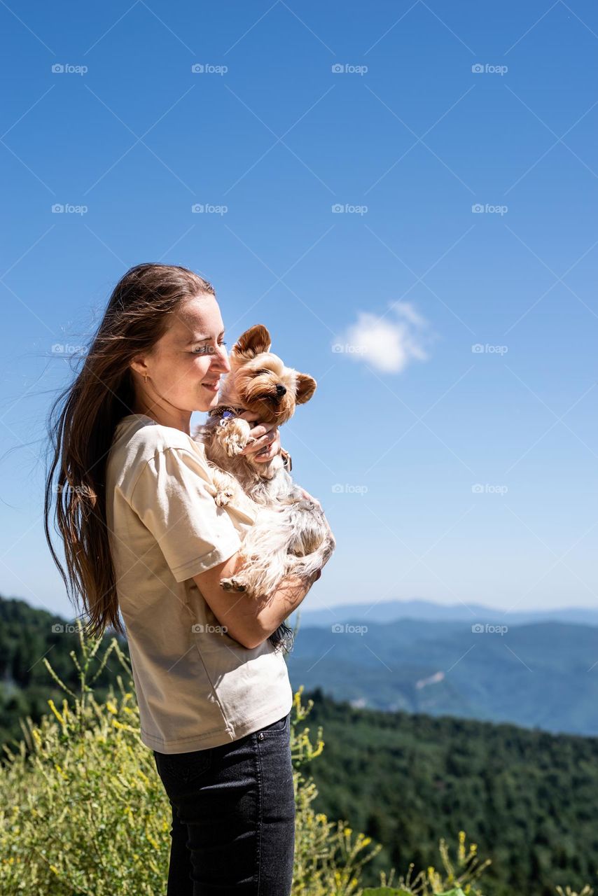 woman with dog in mountain