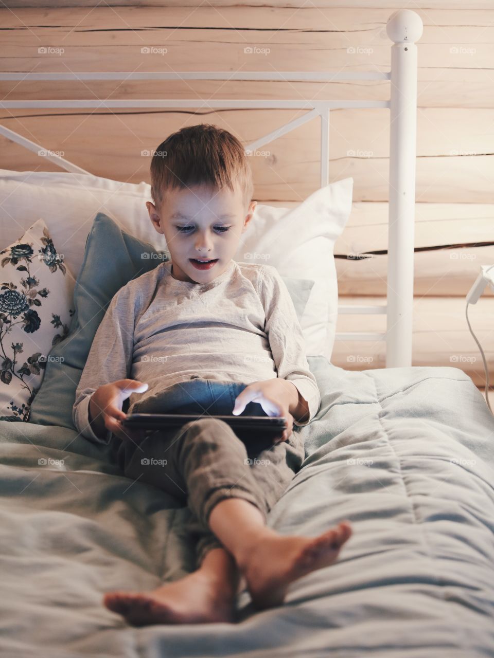 boy playing on the tablet