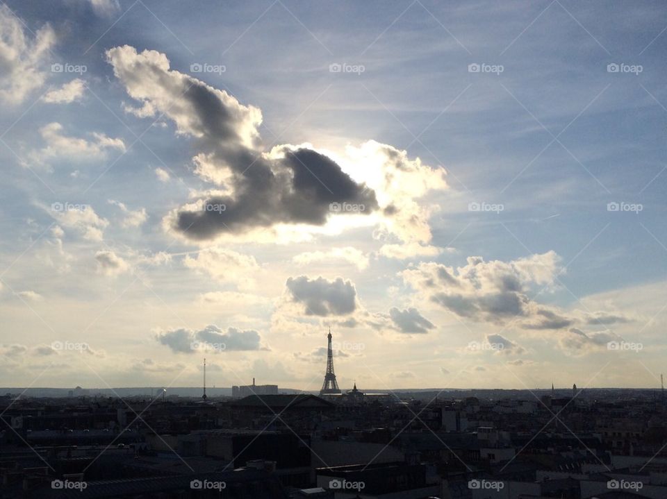 Silhouette of Eiffel Tower and clouds
