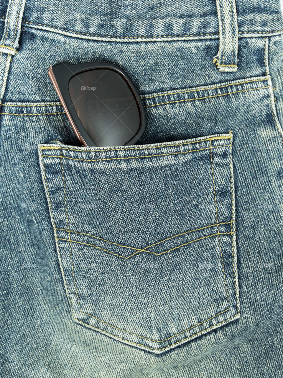 Sunglasses in jeans pocket