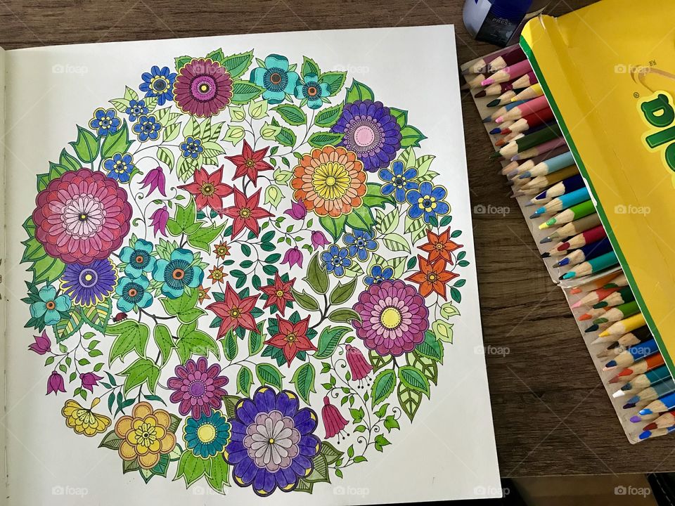 Enjoying colouring in an adult colouring book while being quarantined during COVID outbreak