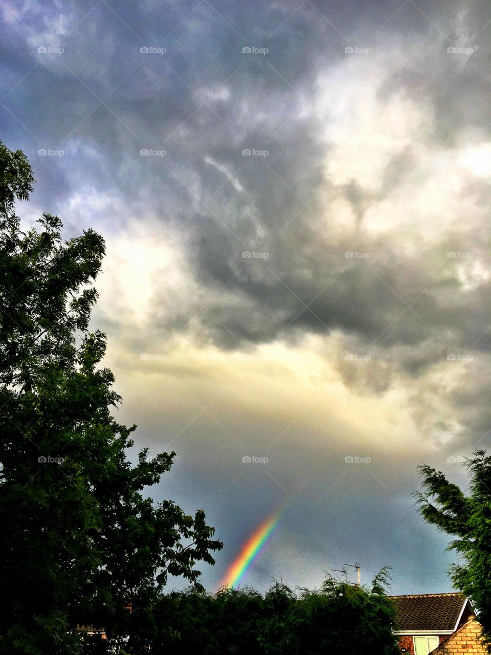 Passing storm and fading rainbow