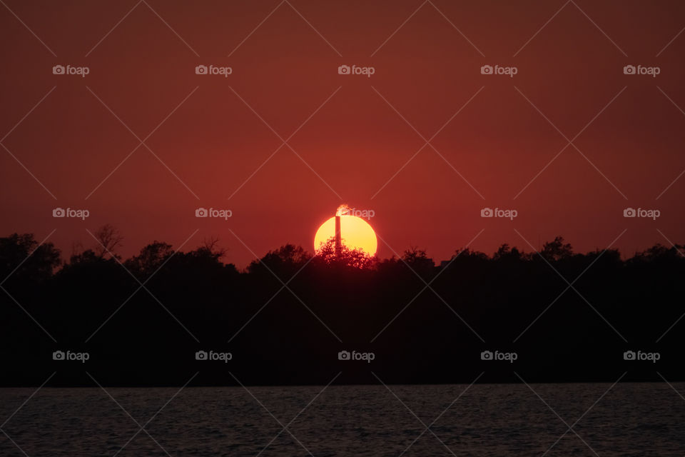Sun and flame of chimney