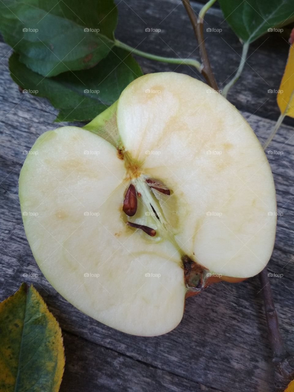 Apple on wooden table.