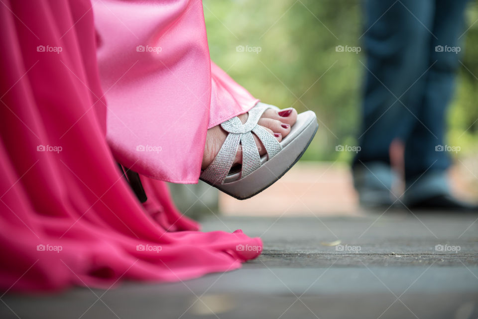 Close-up of person wearing shoes