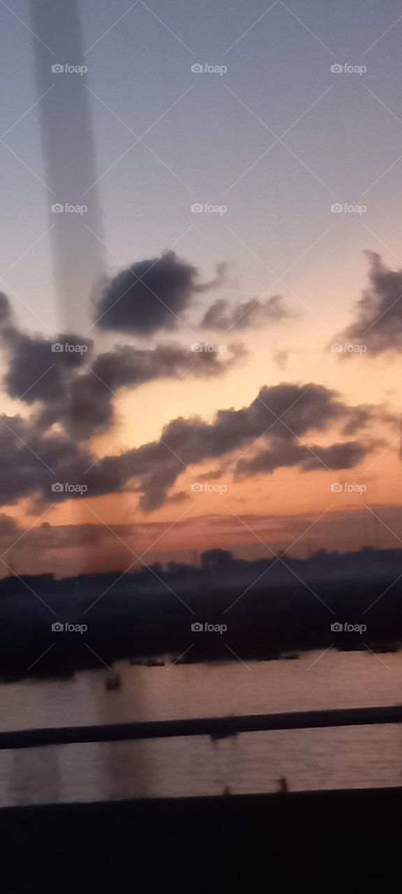 Rare view of the night sky with clouds in varying colours.Truly a beauty to behold.