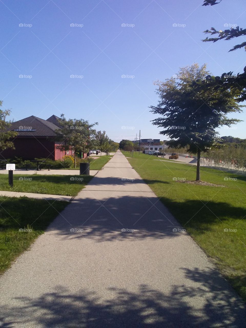 The EIsenbahn State Trail looking. South at the old depot in West Bend, Wisconsin.