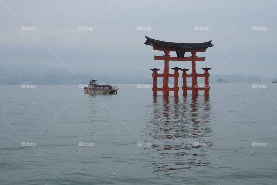 Tori Inside the sea with a boat