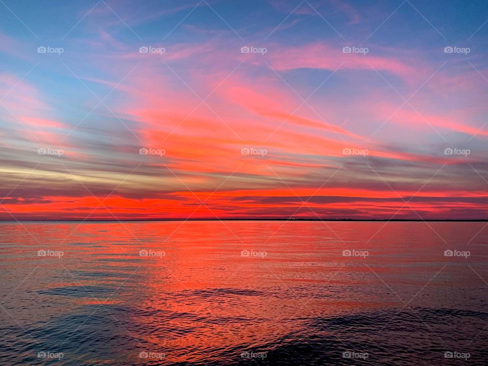 A Kaleidoscope of colors - The evening sunset was lighted up with a orange and pink radiance, glorious to behold, and increasing every moment in splendor
