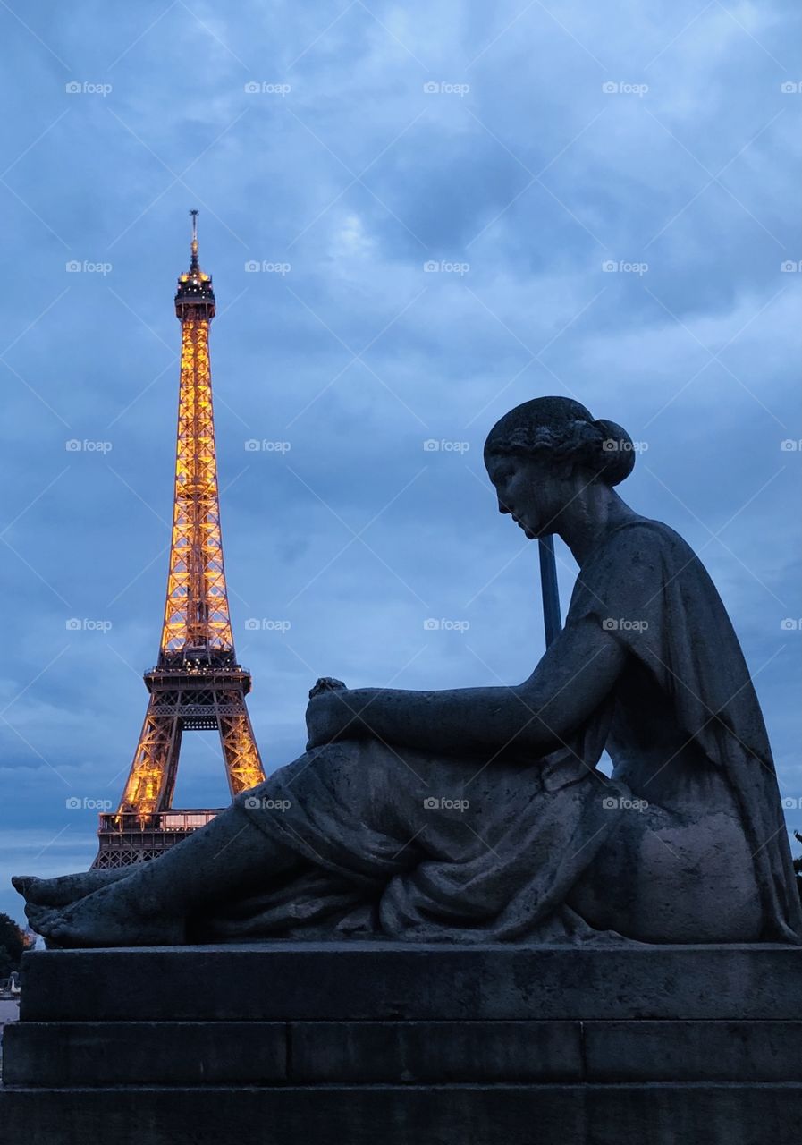 Eiffel Tower and a woman sculpture
