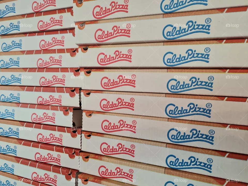stacked cardboard pizza boxes