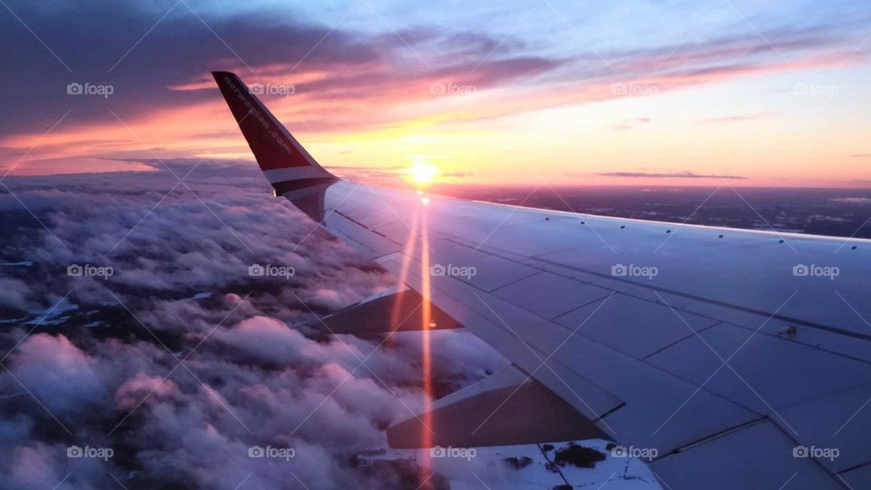 Flying with Norwegian in sunset