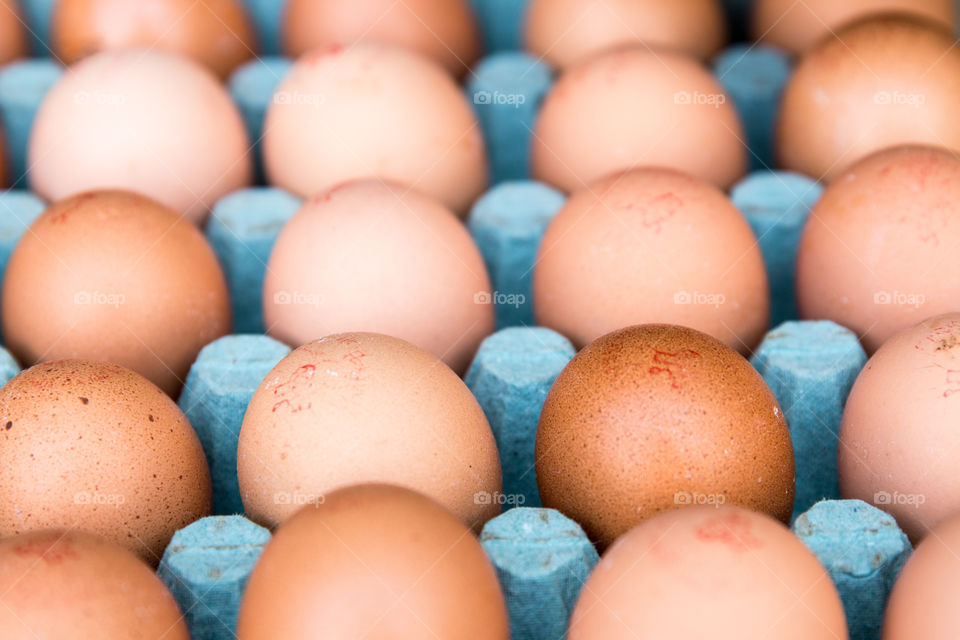 Brown Eggs In Cardboard Box
