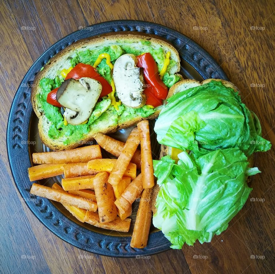Sandwich made with dill rye, veggies, tofu, vegan cheese and avocado. Served with a side of carrot fries.