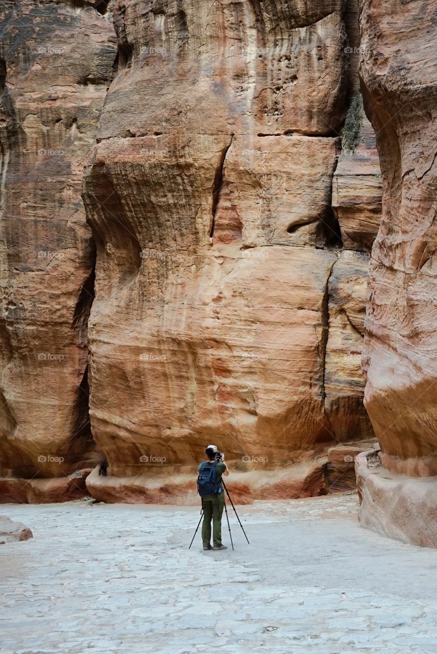 photographer taking shot on the rock of Petra of Jordan