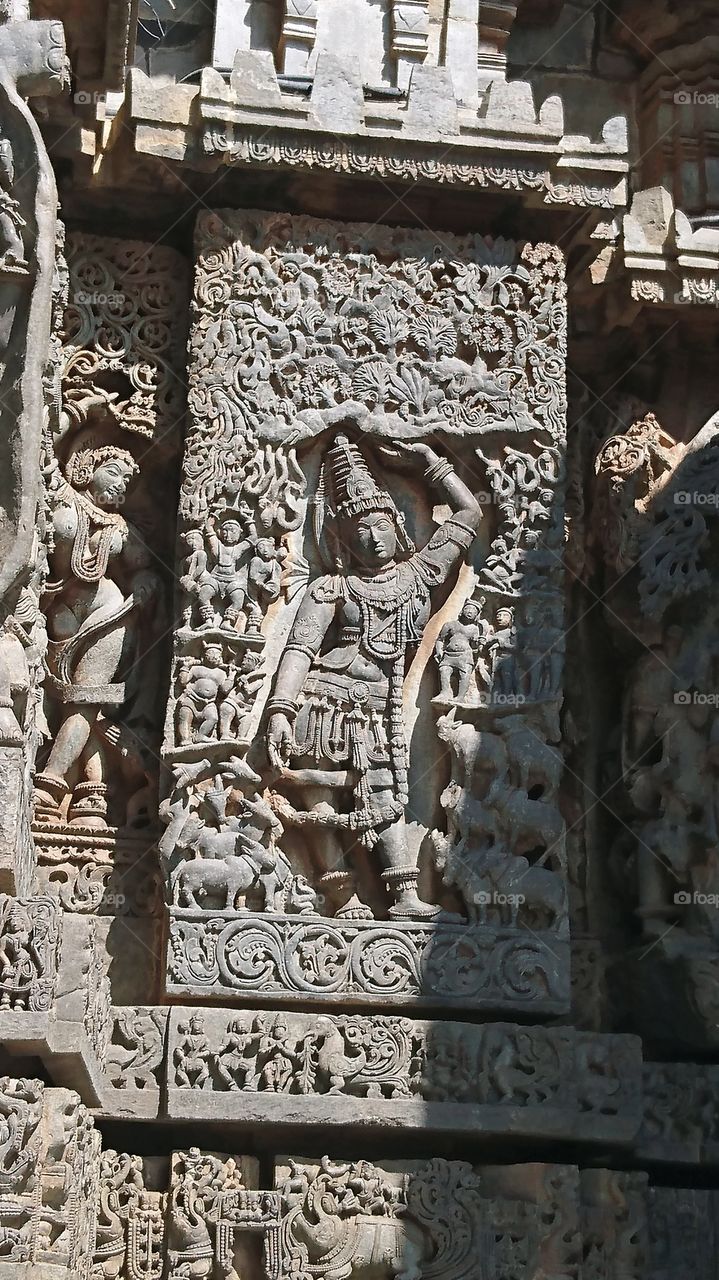 Halebeedu Hoysaleeswara temple - Krishna lifting the mountain Govardhana